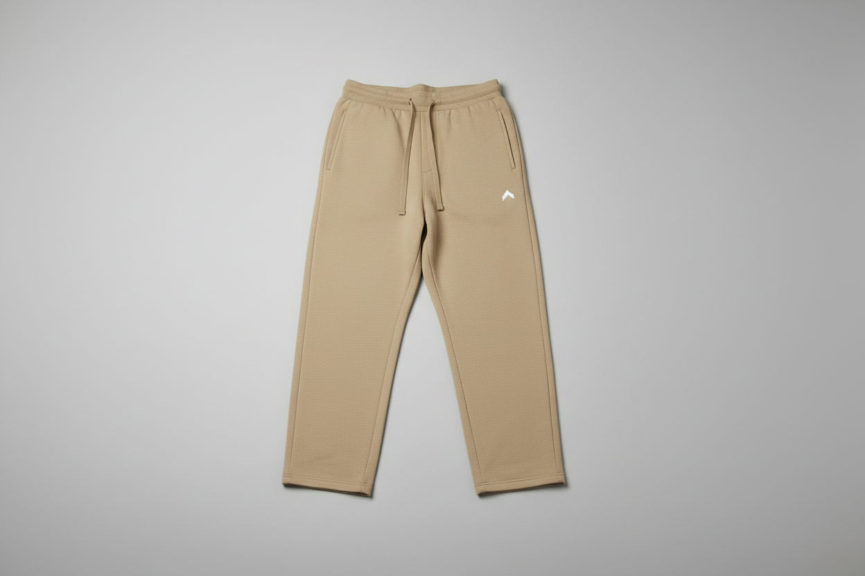Beige sweatpants flat on floor