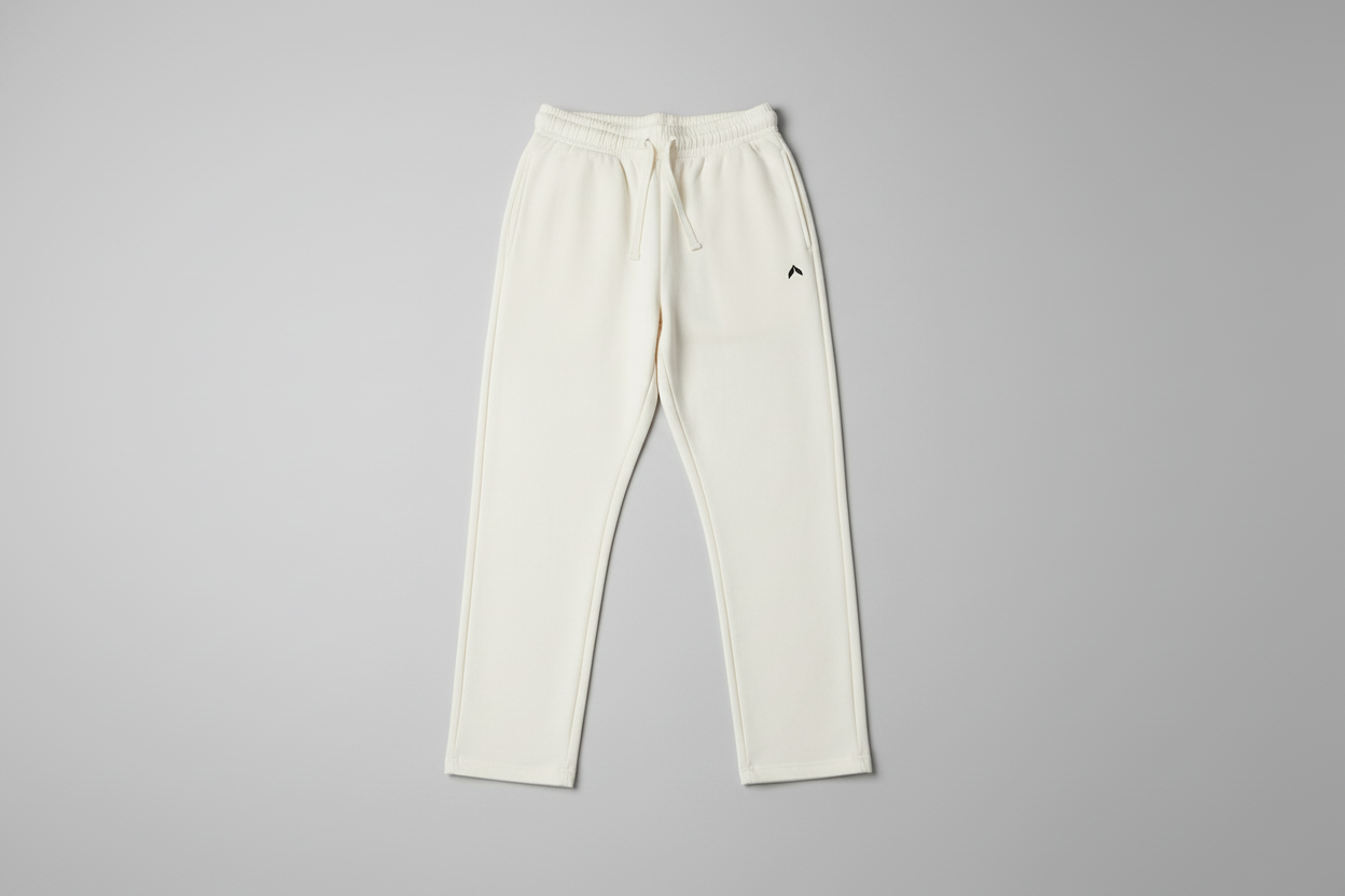 Cream sweatpants flat on floor