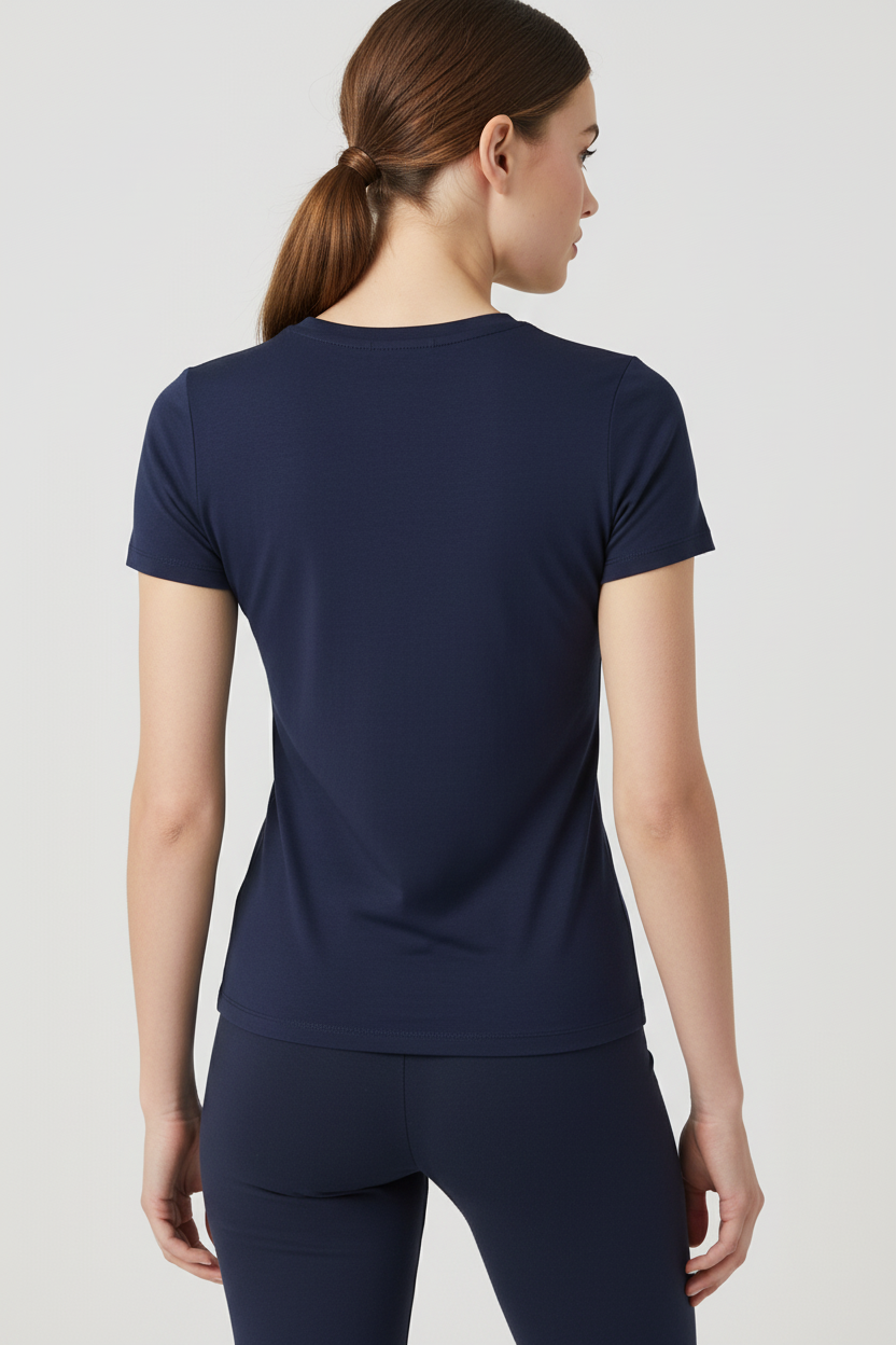 Model in navy blue t-shirt - back view weight shifted