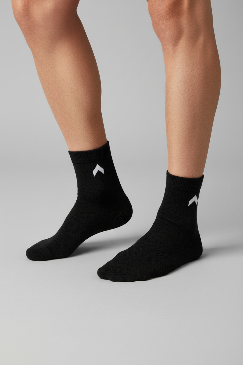 Person wearing black ankle socks